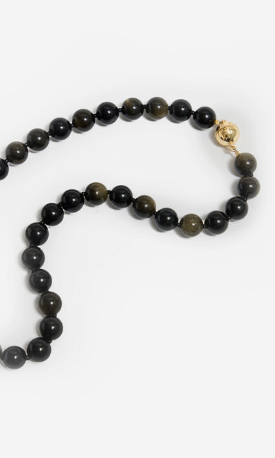 Plümo  Olena Necklace: Black and green golden obsidian, 18kt gold-plated clasp, perfect healing jewelry on white background.