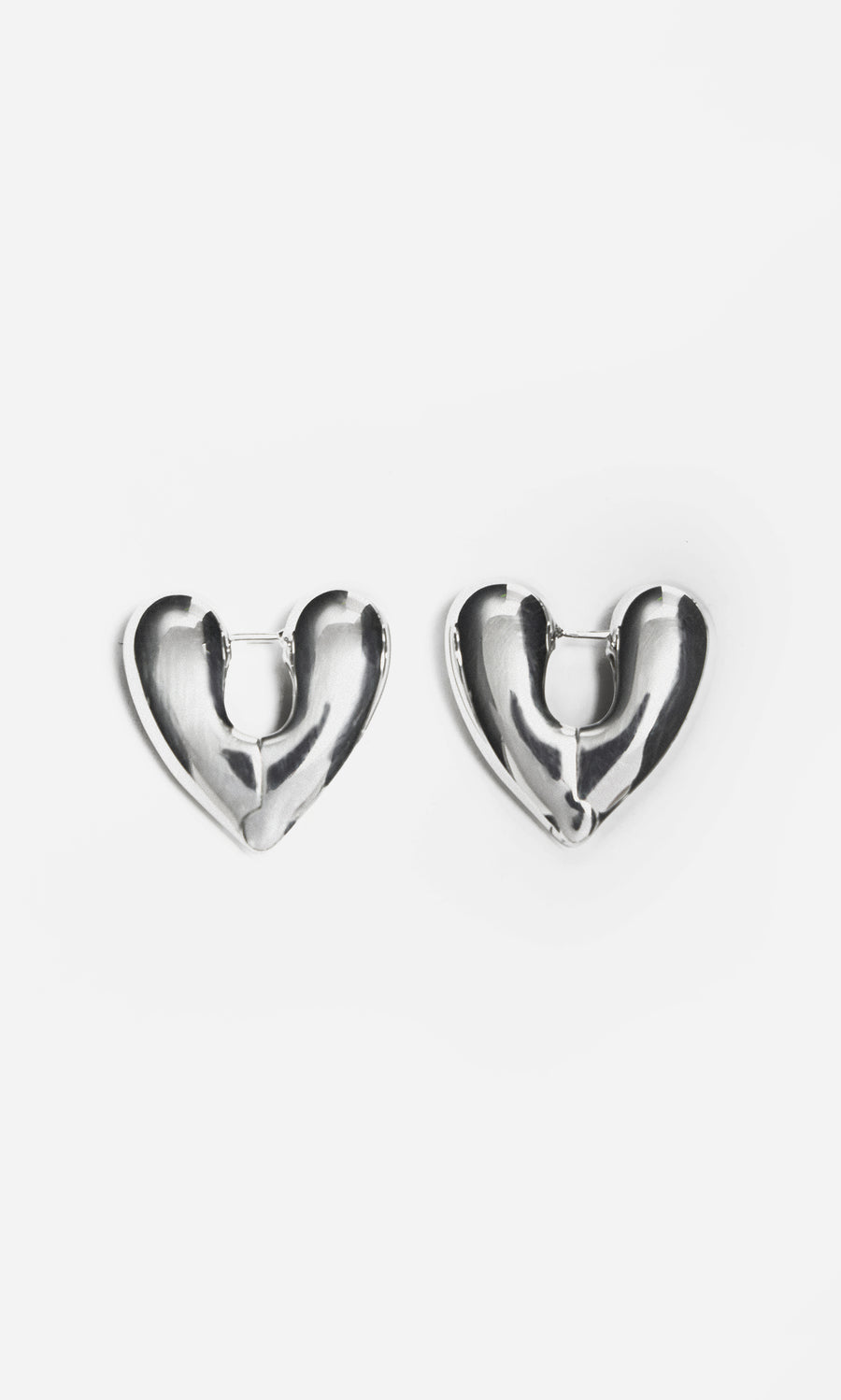 Plümo  Silver Heart Earrings made from recycled sterling silver displayed on a plain white background.