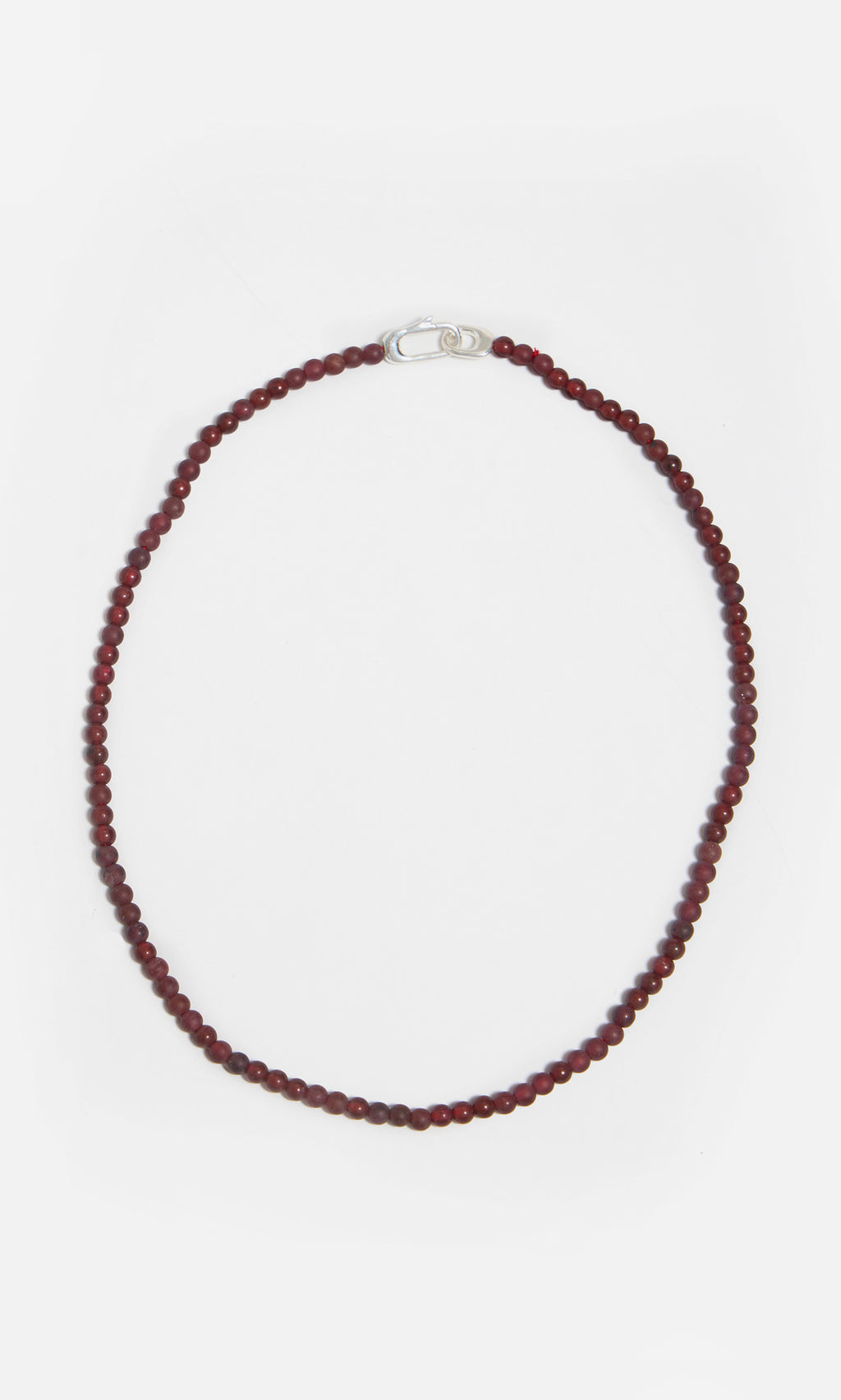 Plümo  The Rowena Necklace features small round red jasper beads and a sterling silver clasp in a single-strand design.