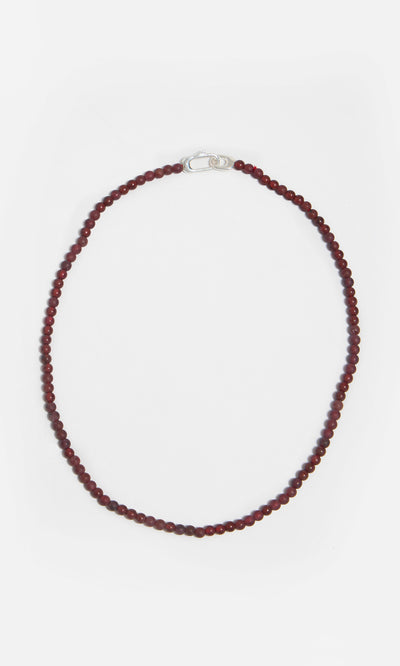 Plümo  The Rowena Necklace features small round red jasper beads and a sterling silver clasp in a single-strand design.