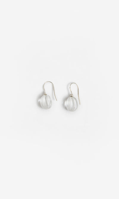 Plümo  Tamsin Earrings: Handcrafted crystal quartz with clear glass beads and silver hooks on a white background.