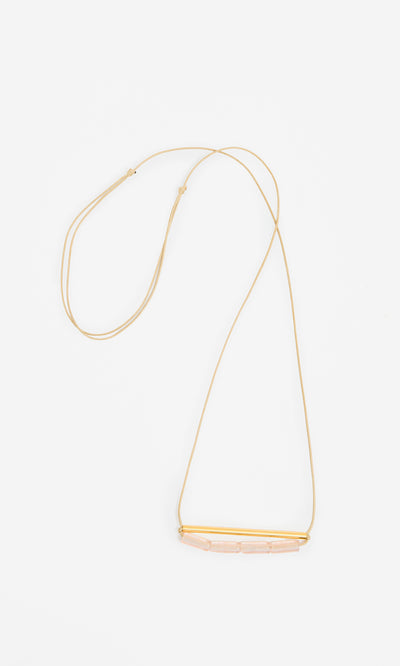 Plümo  Barillo Necklace - Clear: Gold chain with a gold bar and four clear stones, adjustable length, on white background.