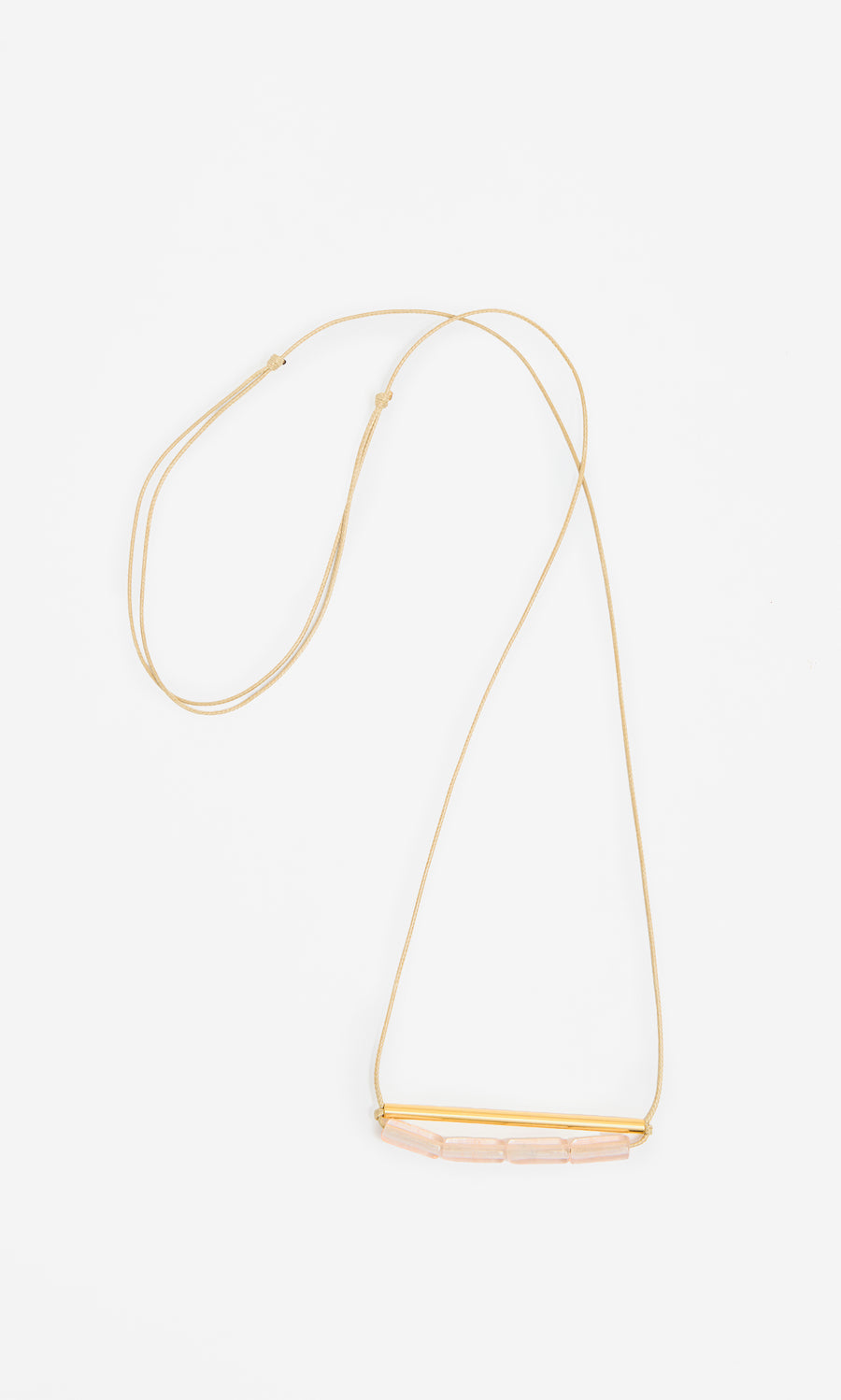 Plümo  Barillo Necklace - Clear: Gold chain with a gold bar and four clear stones, adjustable length, on white background.