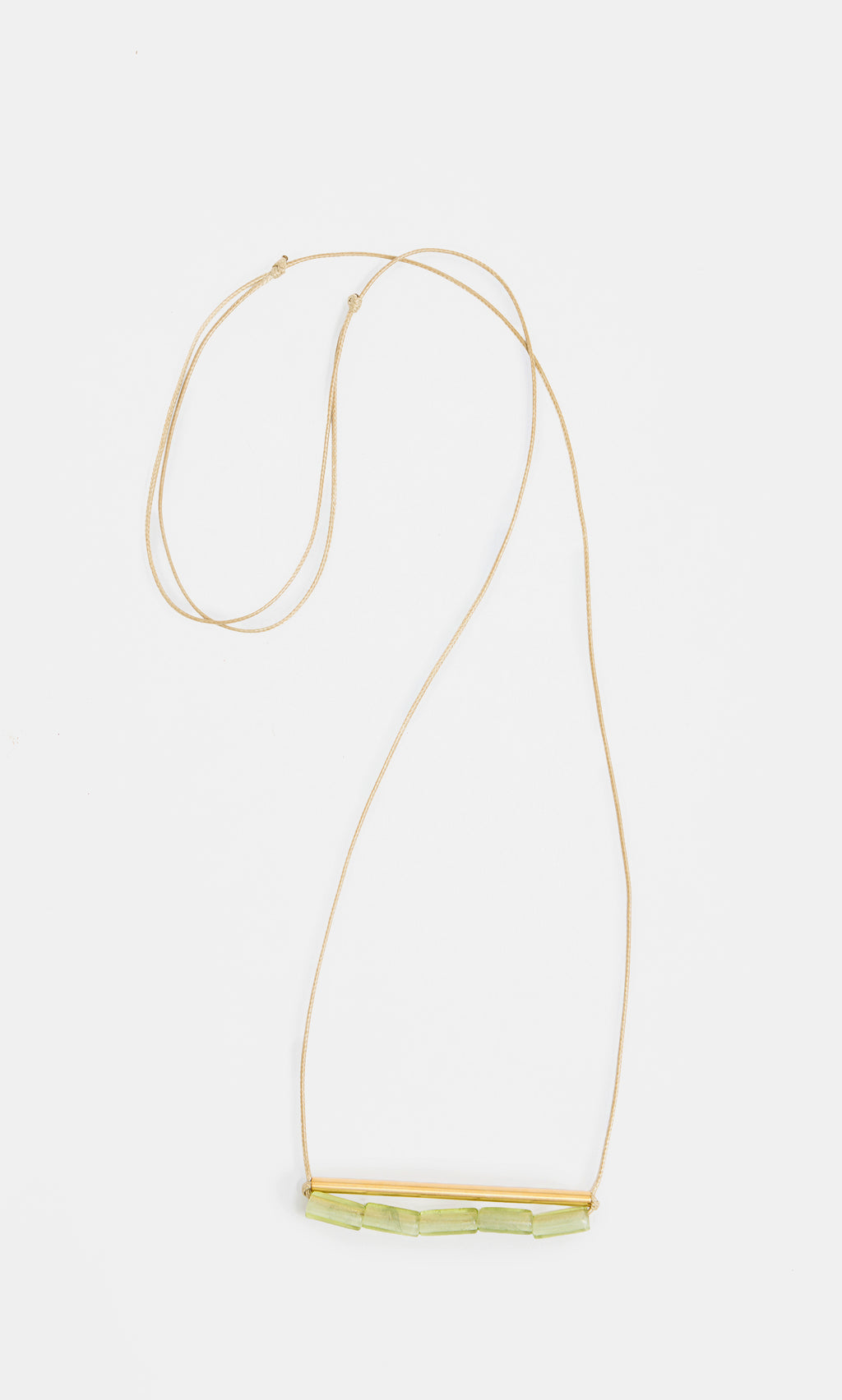 Plümo  Lydia Necklace: elegant gold adjustable chain with bar detail and light green stones.