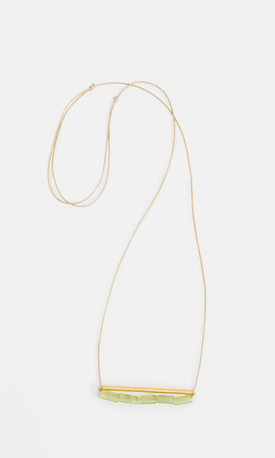Plümo  Lydia Necklace: elegant gold adjustable chain with bar detail and light green stones.
