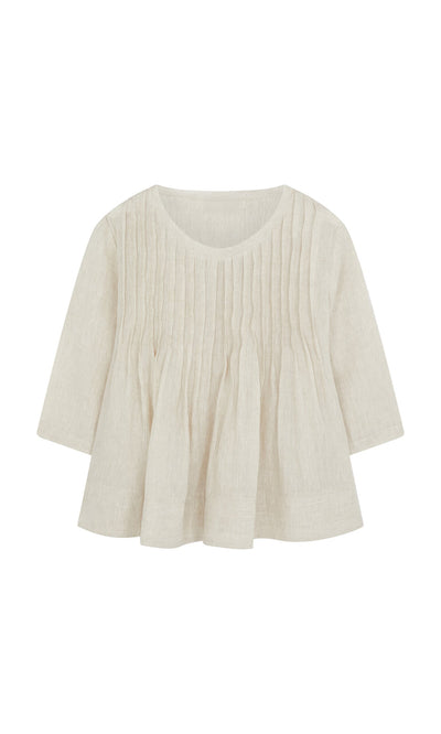 Plümo- The Pantry Blouse is an ecru linen, relaxed fit top with three-quarter sleeves and vertical front pleats.
