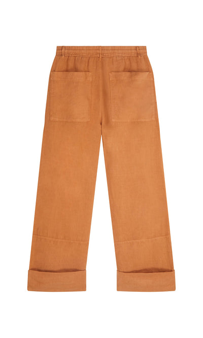 Plümo- Pecan Pocket Pants: rust-colored linen wide-leg pants with drawstring waist, large back pockets, and rolled cuffs.
