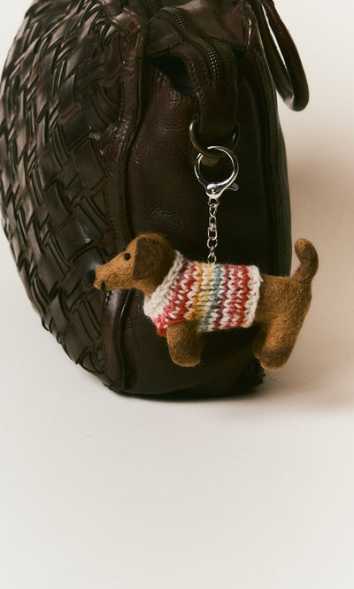 Plümo  Brown woven handbag with a Sausage Dog Keyring—hand-felted wool dachshund in colorful knit sweater on the handle.