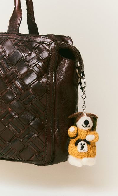 Plümo  Brown woven leather bag with Rambling Roger Keyring—hand-felted wool dog in a yellow sweater, handcrafted in Nepal.