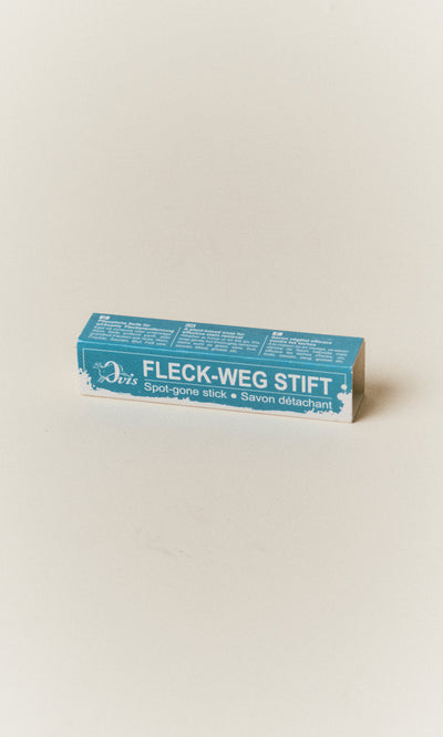 Plümo  Rectangular Stain Remover Stick box with multilingual product information on a light surface.