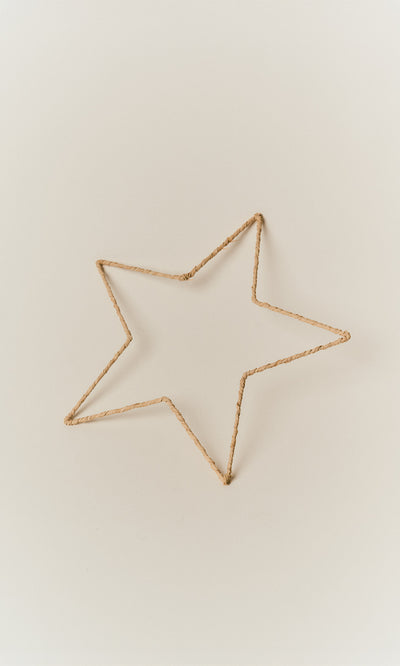 Plümo  Raffia Christmas Star, a five-pointed star ornament handmade from wrapped tan raffia.