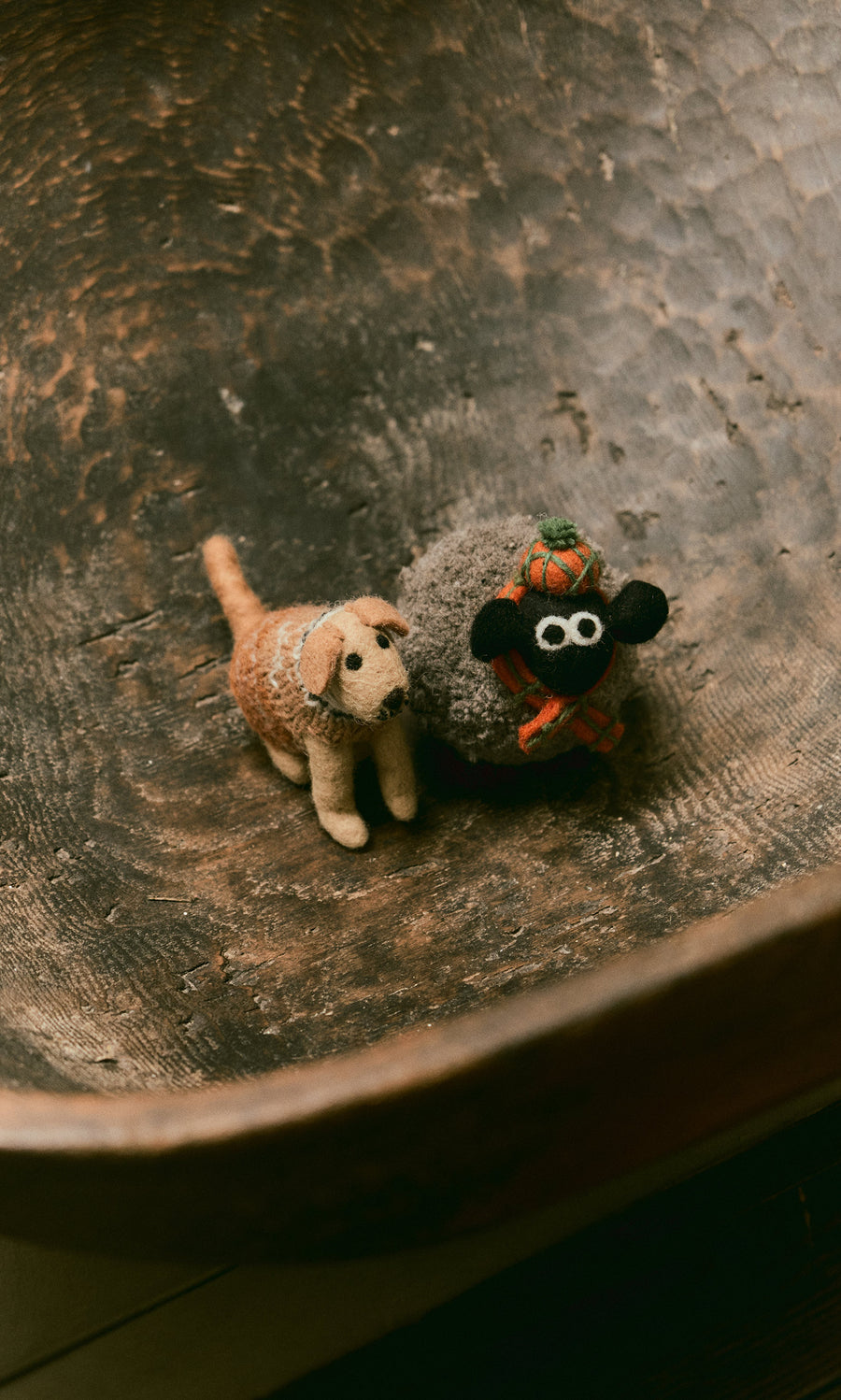 Plümo  Digby the Labrador and a sheep sit in a large rustic wooden bowl, hand-felted wool from fairtrade Nepal.