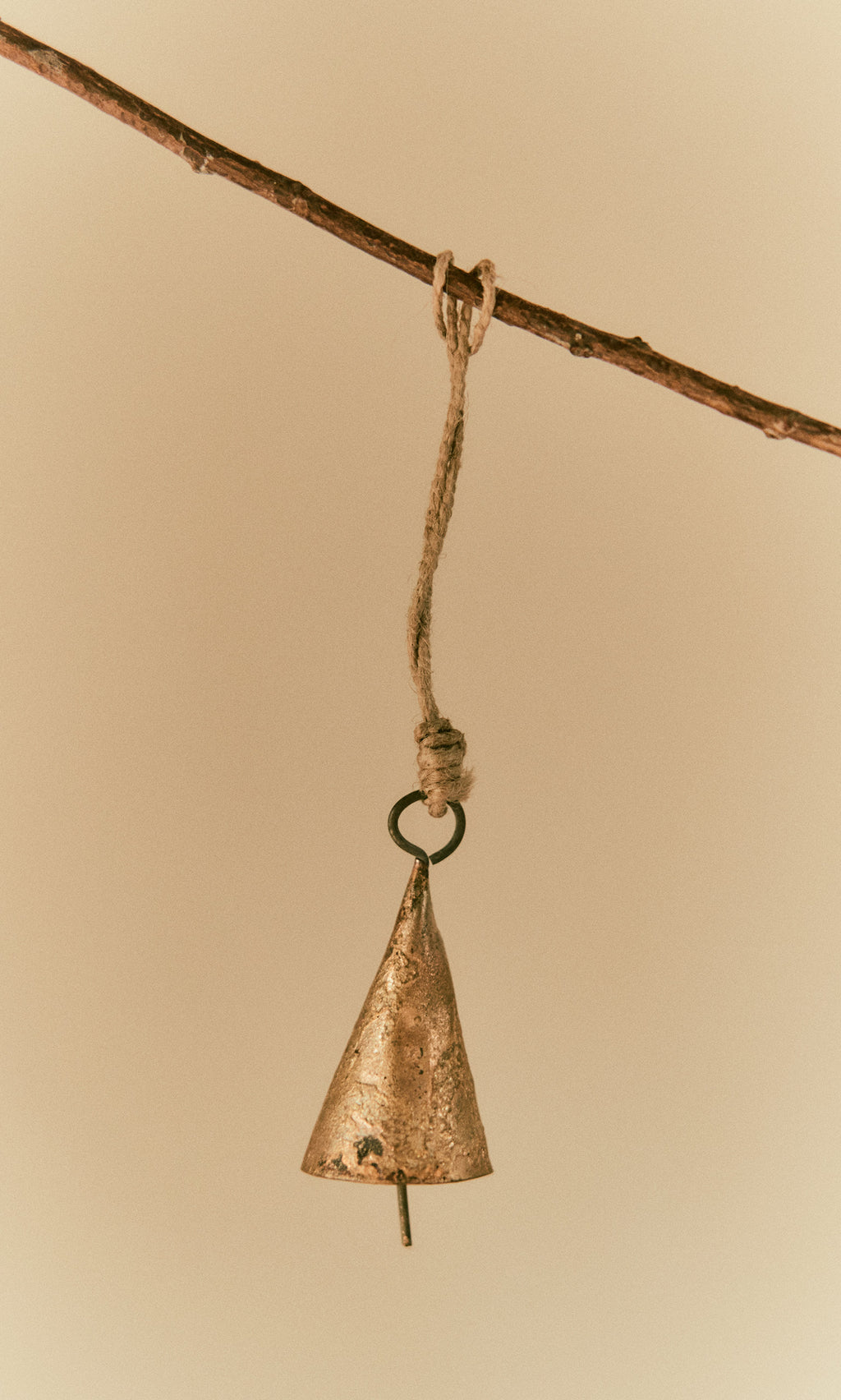 Plümo  The Hanging Brass Bell - Small dangles from twine, ready to fill the air with its gentle chime.