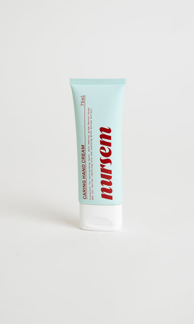 Plümo- Light blue tube of Nursem Hand Cream (75ml) with Manuka honey, upright on a white background.