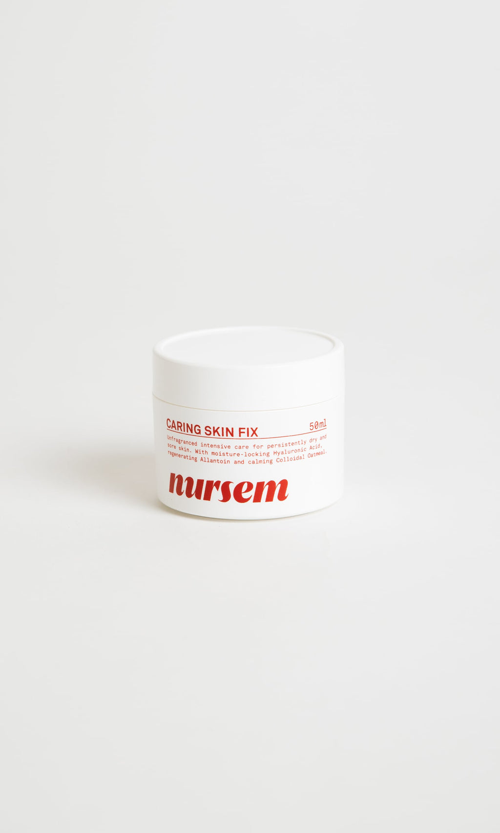 Plümo- Nursem Caring Skin Fix: white jar with red text, provides natural relief for dry skin.
