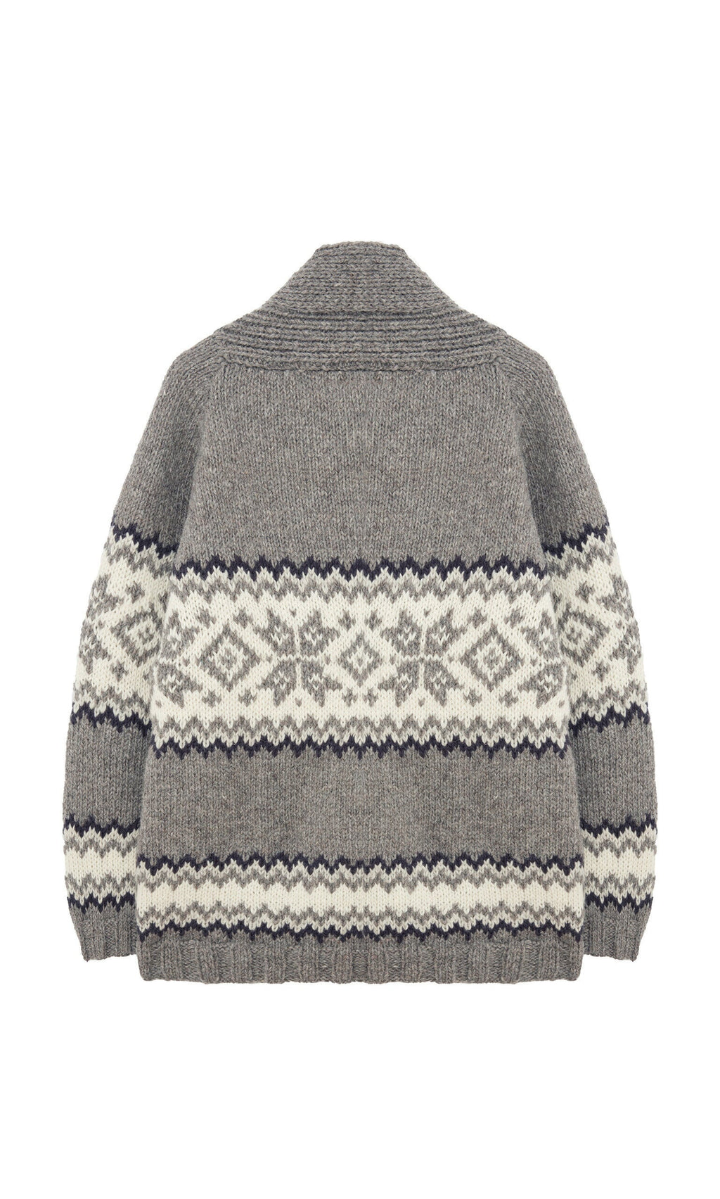 Plümo- The Shingle Cardigan is an oversized, handknitted wool piece with black and white geometric patterns, shown from the back.