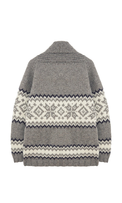 Plümo- The Shingle Cardigan is an oversized, handknitted wool piece with black and white geometric patterns, shown from the back.