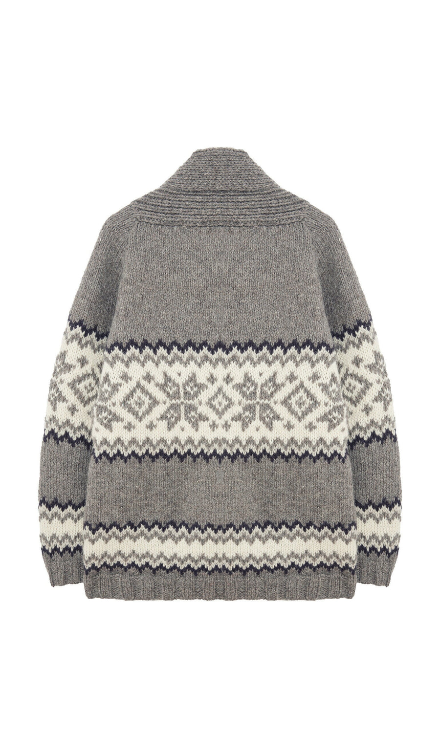 Plümo- The Shingle Cardigan is an oversized, handknitted wool piece with black and white geometric patterns, shown from the back.