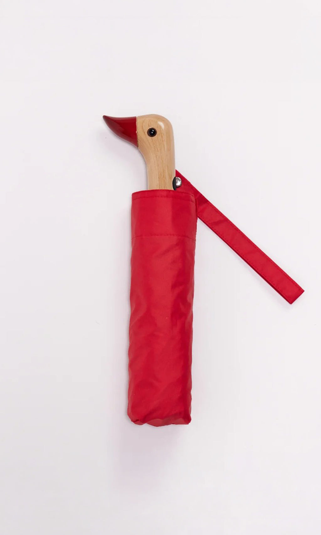 Plümo  The Duck Umbrella - Red features a compact design and a duck-shaped wooden handle, set against a white background.