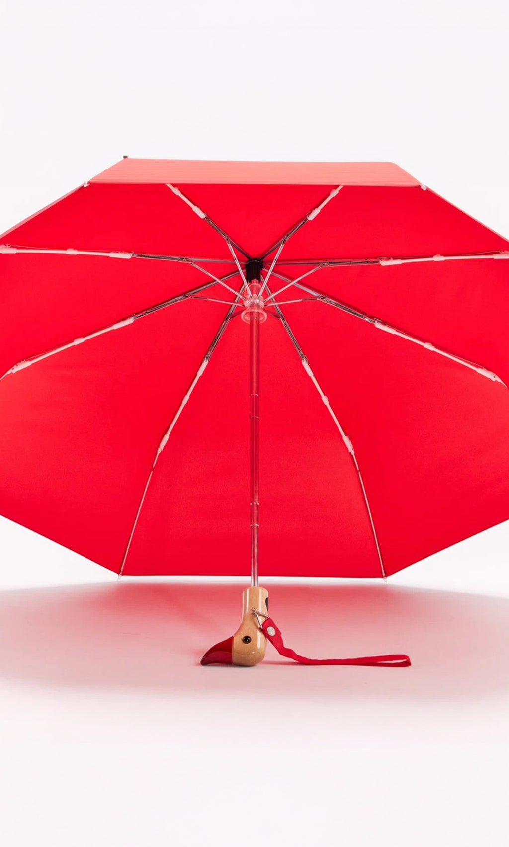 Plümo  Duck Umbrella - Red, wind resistant with wooden handle, open upright on white background.