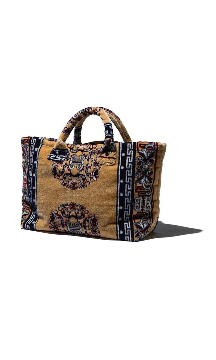 Plümo- Rectangular Rug Bag - Antik Gold with round handles and ornate gold, blue, and red patterned fabric.