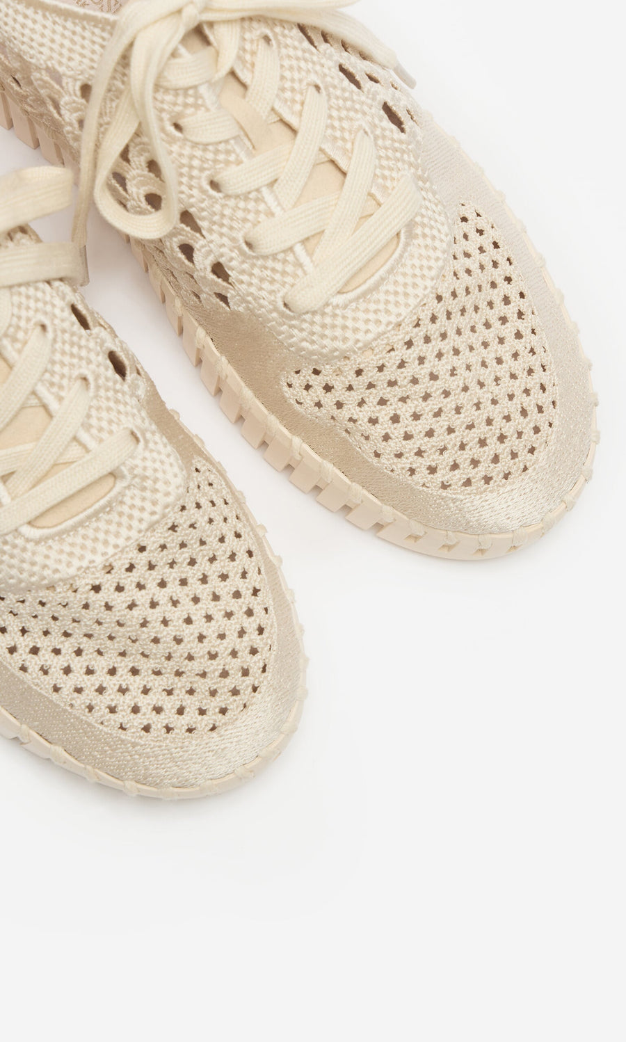 Plümo- Close-up of Runa Trainers mesh sneakers with breathable embroidered upper and perforated design.