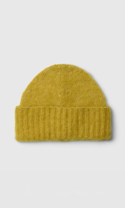 Plümo  Avo Wool Beanie in mustard yellow, featuring a thick ribbed cuff, shown on a plain white background.