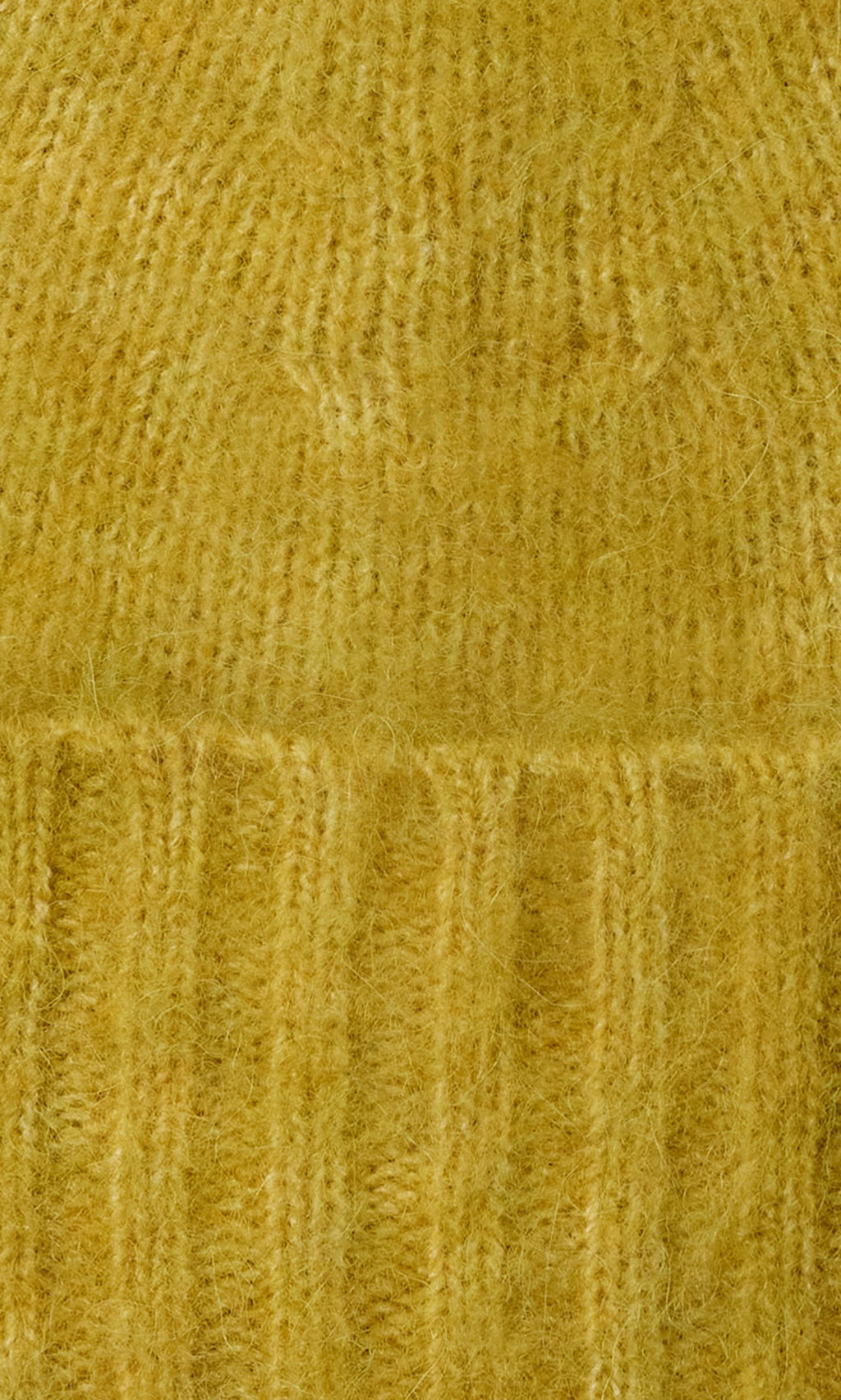 Plümo  Close-up of Avo Wool Beanie in yellow, featuring fuzzy knit with vertical and horizontal ribbed patterns and cuff.