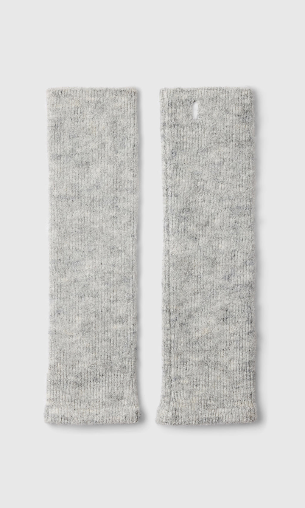 Plümo  Set of two light gray Grey Wrist Warmers, Danish design; one features a buttonhole near the top edge.