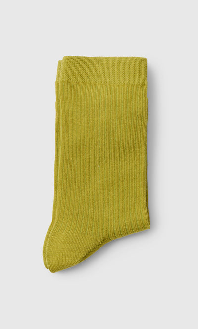 Plümo  A single folded Bright Green Sock is shown on a plain light gray background.
