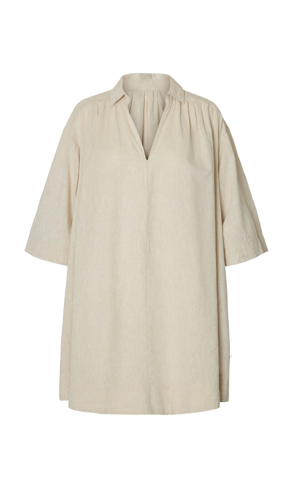 Plümo- The Cory Tunic is a beige, loose linen smock dress with a V-neck, 3/4 sleeves, and a relaxed A-line shape.