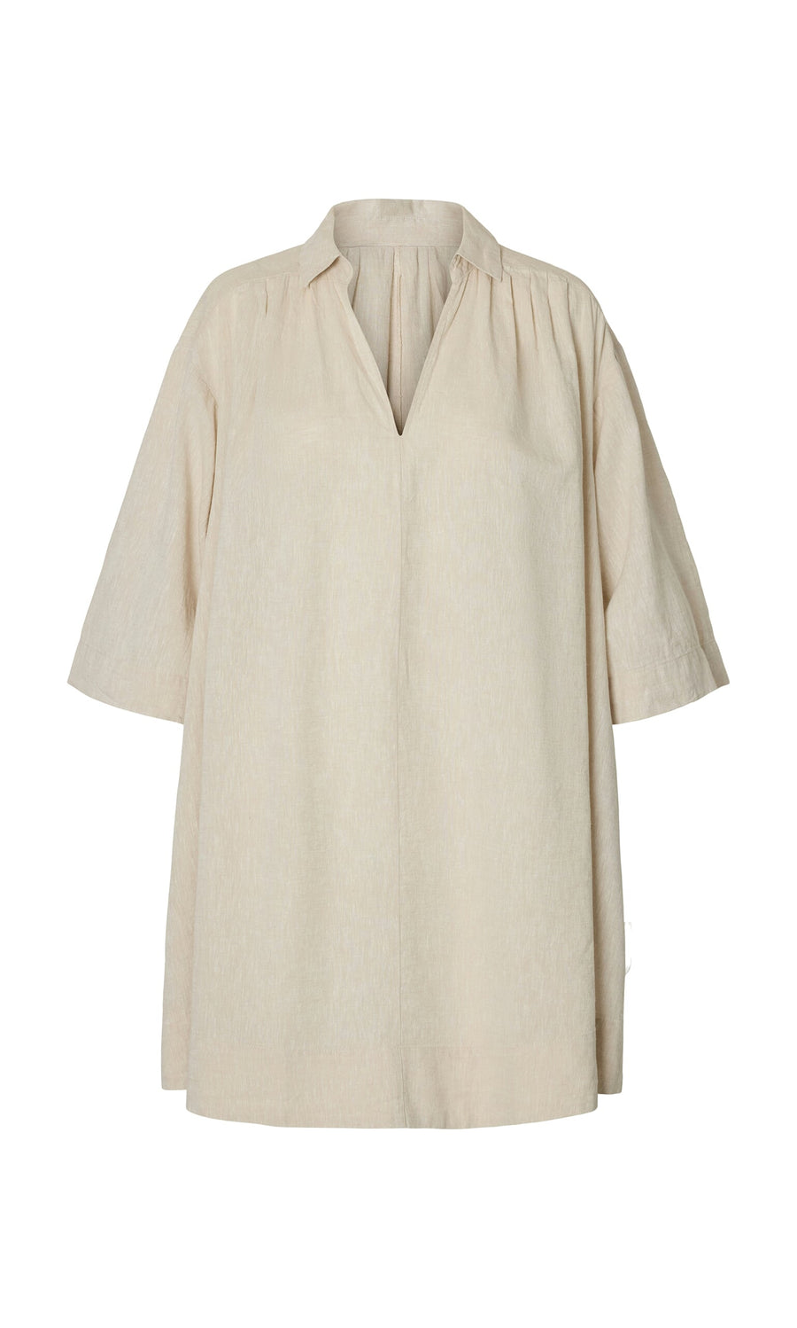 Plümo- The Cory Tunic is a beige, loose linen smock dress with a V-neck, 3/4 sleeves, and a relaxed A-line shape.