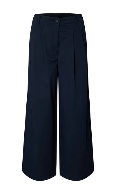 Plümo- Wide Navy Chinos: organic navy cotton culotte pants with wide-leg silhouette and button-zip closure.