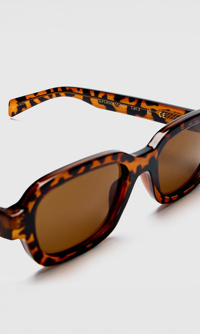 Plümo- Portia Sunglasses: Tortoiseshell frames with brown UV lenses, displayed on a white background.