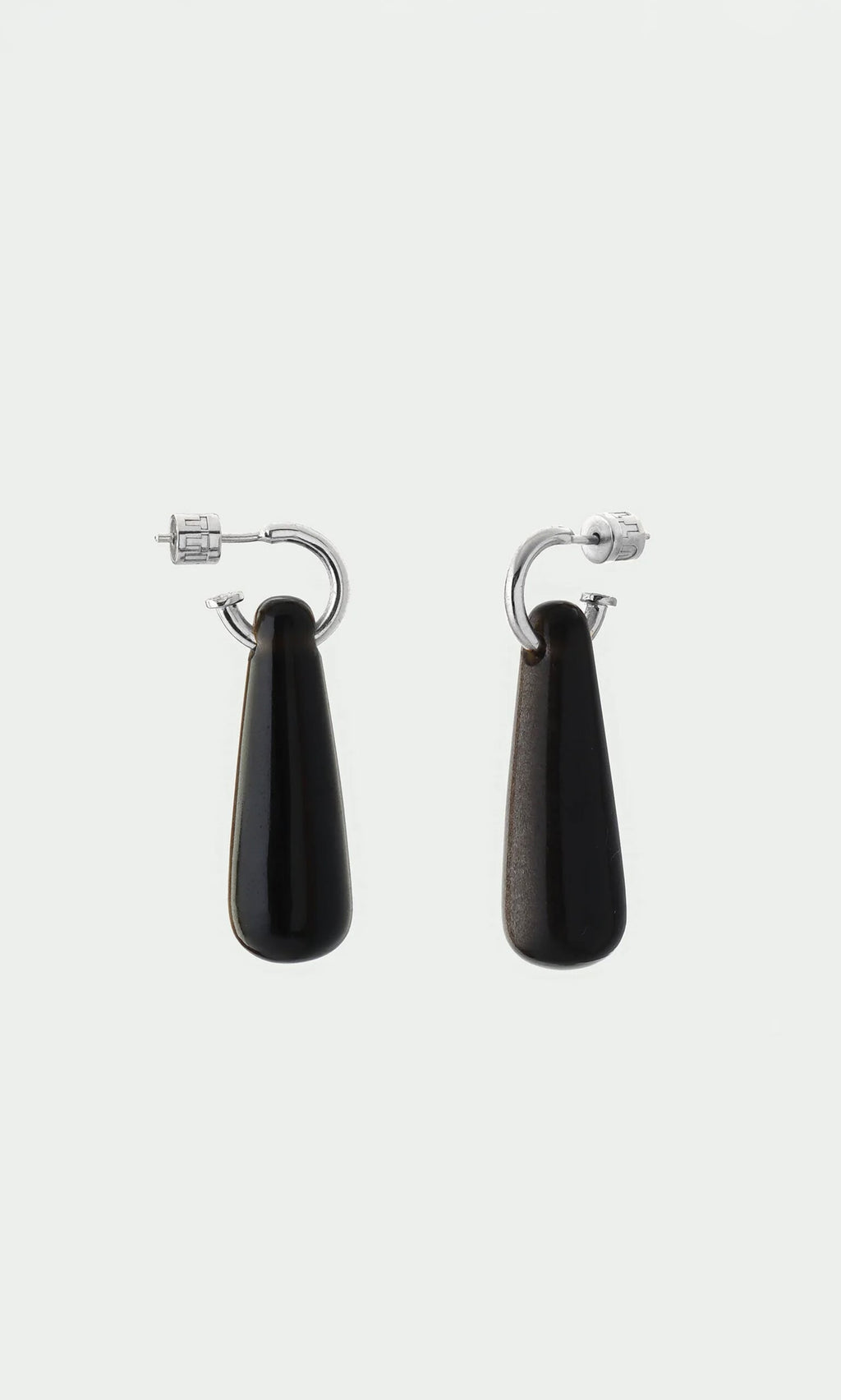 Plümo- Hera Earrings: Silver huggie hoops with long black teardrop pendants—protective healing jewelry.