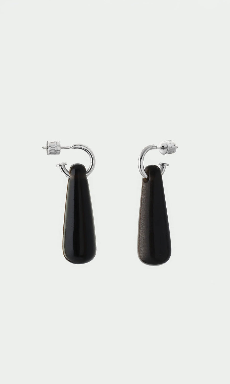 Plümo- Hera Earrings: Silver huggie hoops with long black teardrop pendants—protective healing jewelry.