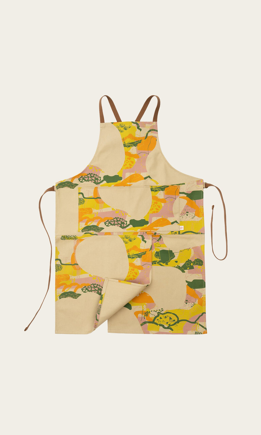 Plümo- Split Front Apron with abstract yellow, orange, and green patterns, brown straps, and two front pockets.