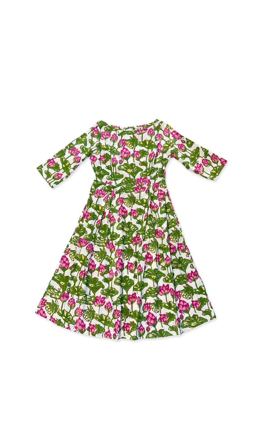 Plümo- The Enja Dress: a one-off cotton-voile piece with green and pink block-printed waterlilies, laid flat on white.