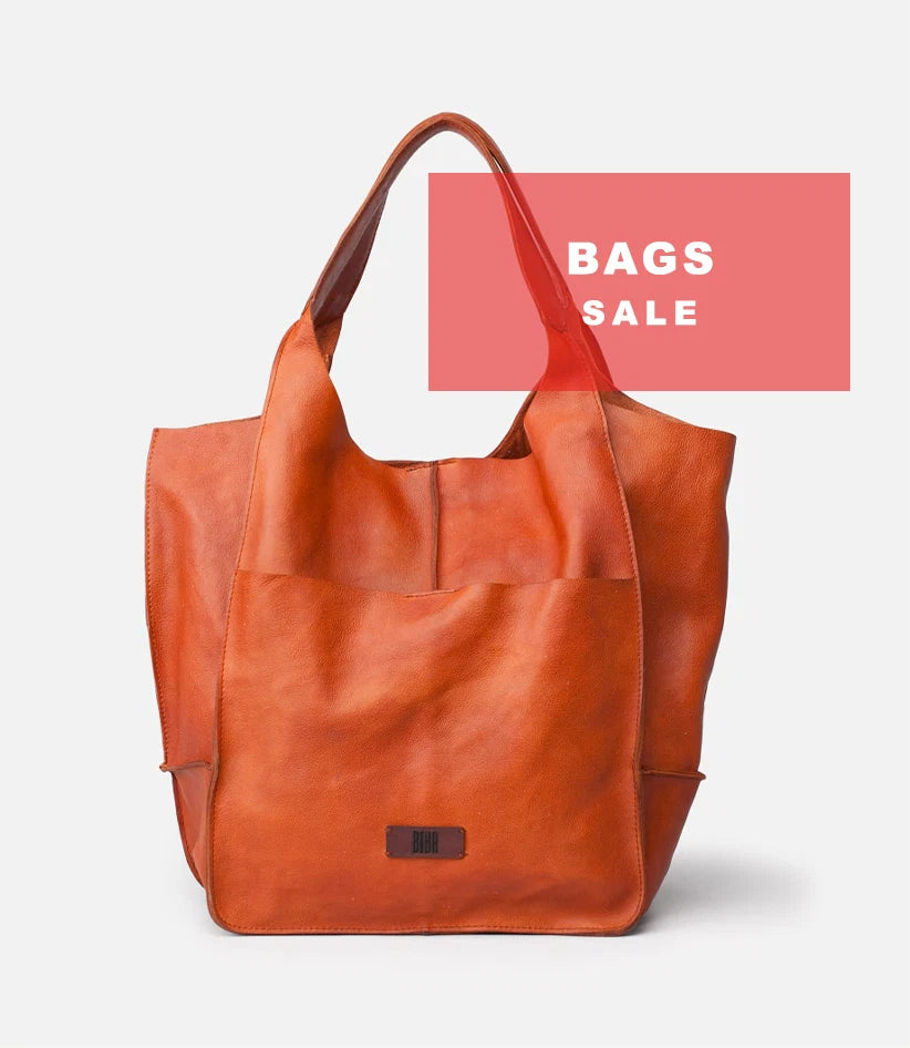 Plümo  Brown leather tote bag with front pocket; text overlay reads BAGS SALE on a pink rectangle in the background.