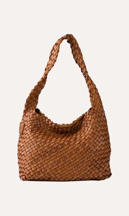 Plümo  A brown woven leather shoulder bag with a single strap, displayed against a plain light background.