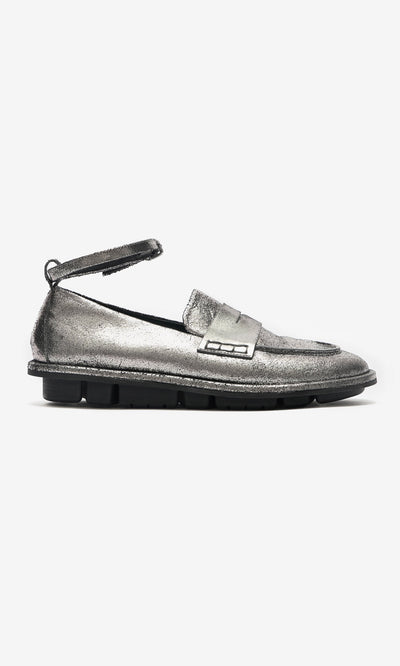 Plümo- Silver Loafers in metallic leather feature detachable ankle straps and a thick black sole, shown in side profile on white.