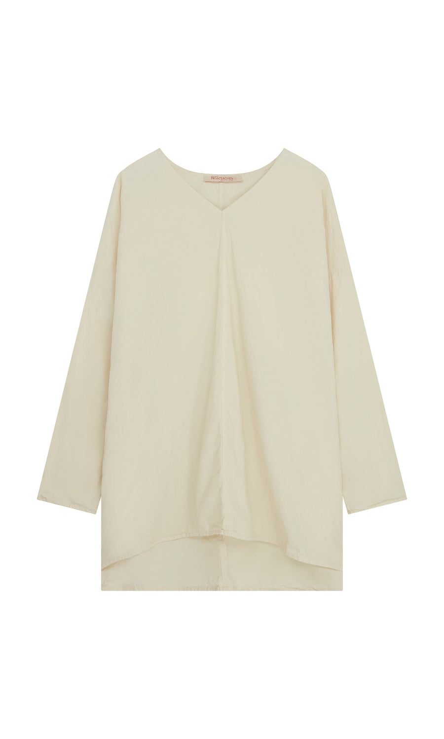 Plümo- Stroh Blouse: cream cotton poplin, V-neck, long sleeves, loose fit, slightly asymmetric hemline.