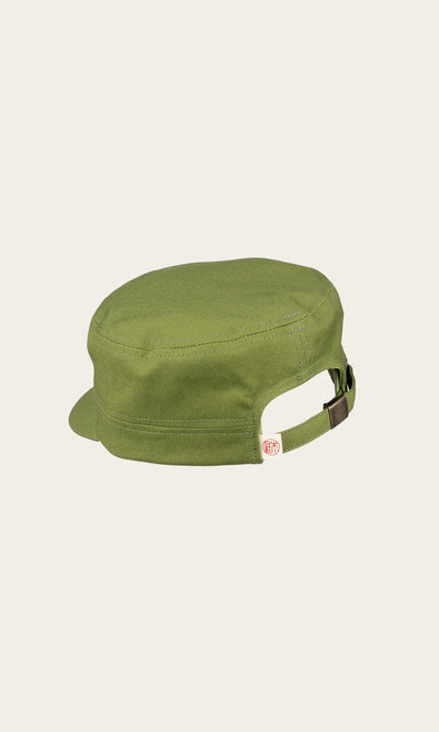 Plümo- The Tsuba Cap: a green Hanpu canvas workman’s cap with adjustable strap, handmade in Kyoto on a plain background.
