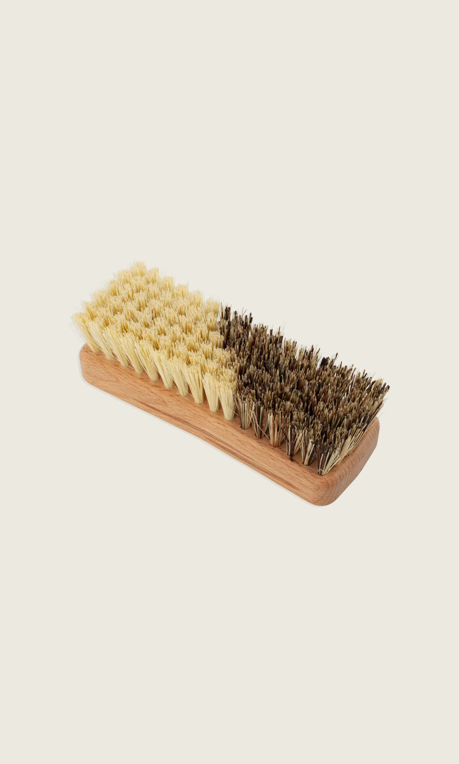 Plümo  Rectangular wooden Vegetable Brush with half light-colored and half dark-colored natural bristles.