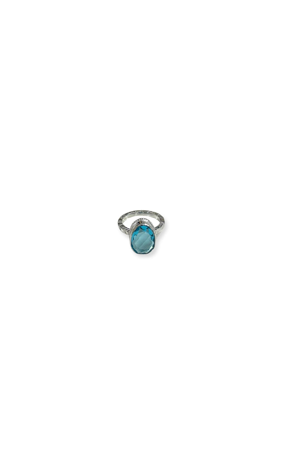 Plümo- The Blue Quartz Ring is a sterling silver band featuring a large, round blue quartz center, shown on a white background.