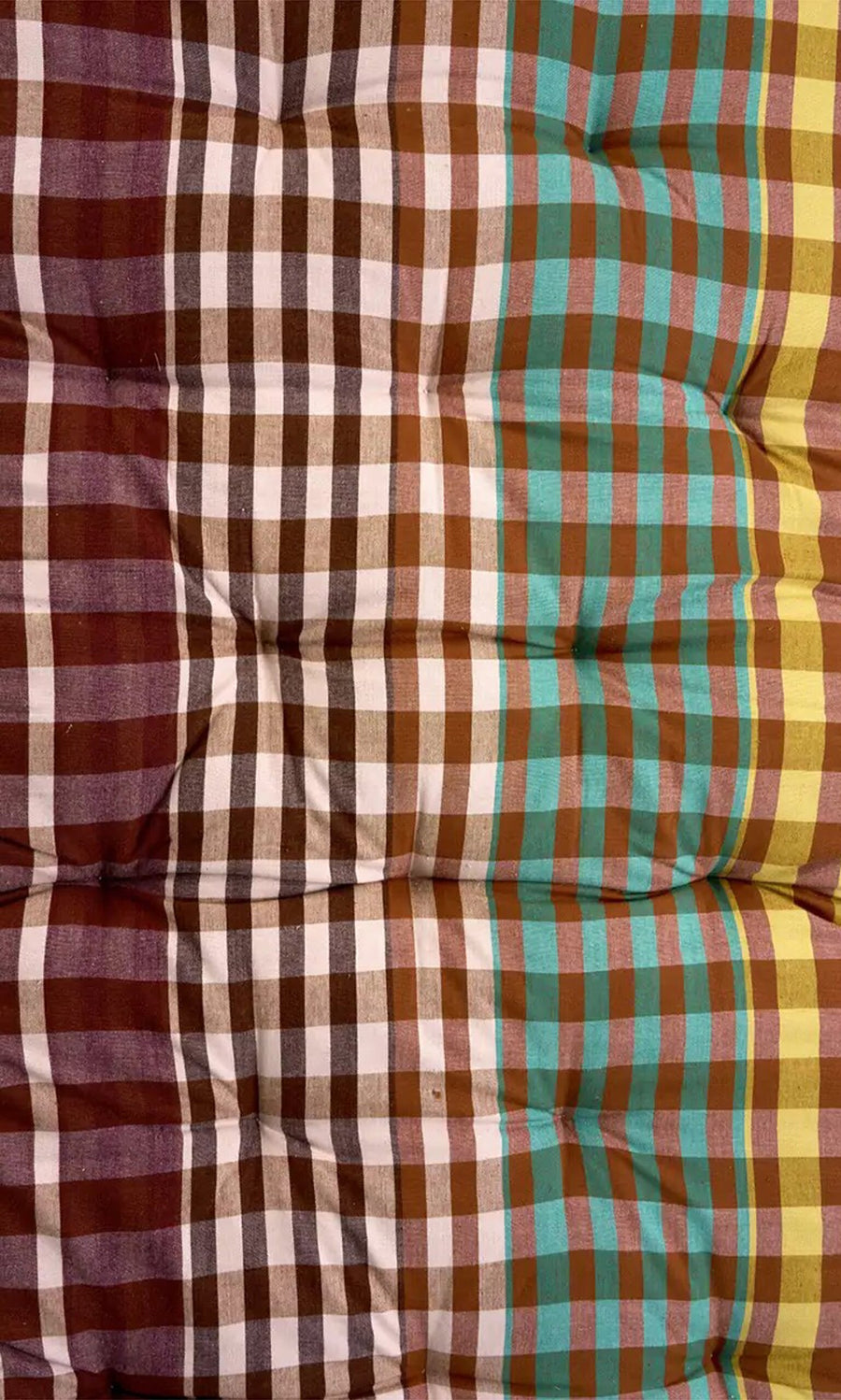 Plümo- Quilted Mattress - Red: Cozy, foldable cotton mattress with colorful plaid stripes in brown, white, teal, and yellow.