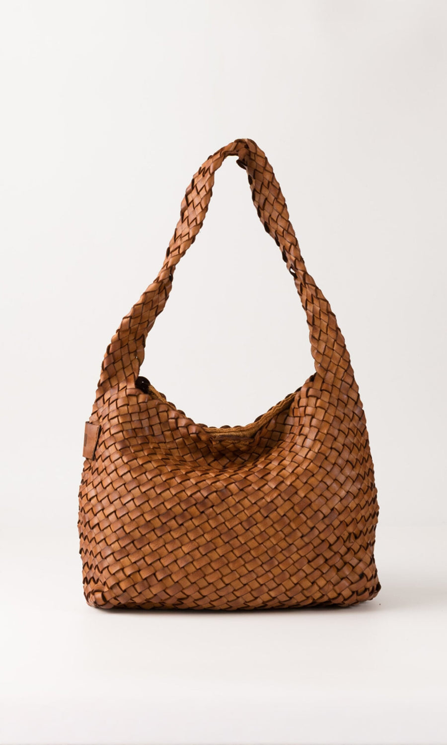 Plümo- The Hilda Bag is a brown, seam-free woven leather hobo with a single shoulder strap on a white background.