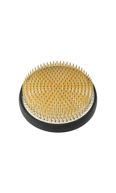 Plümo- A round Kenzan flower frog with a brass top and black base, made in Japan for Ikebana arrangements.
