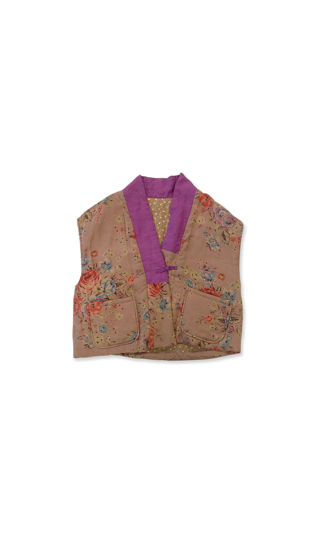 Plümo- The Botan Gilet is a sleeveless, padded linen vest with floral print, front pockets, and a purple collar.