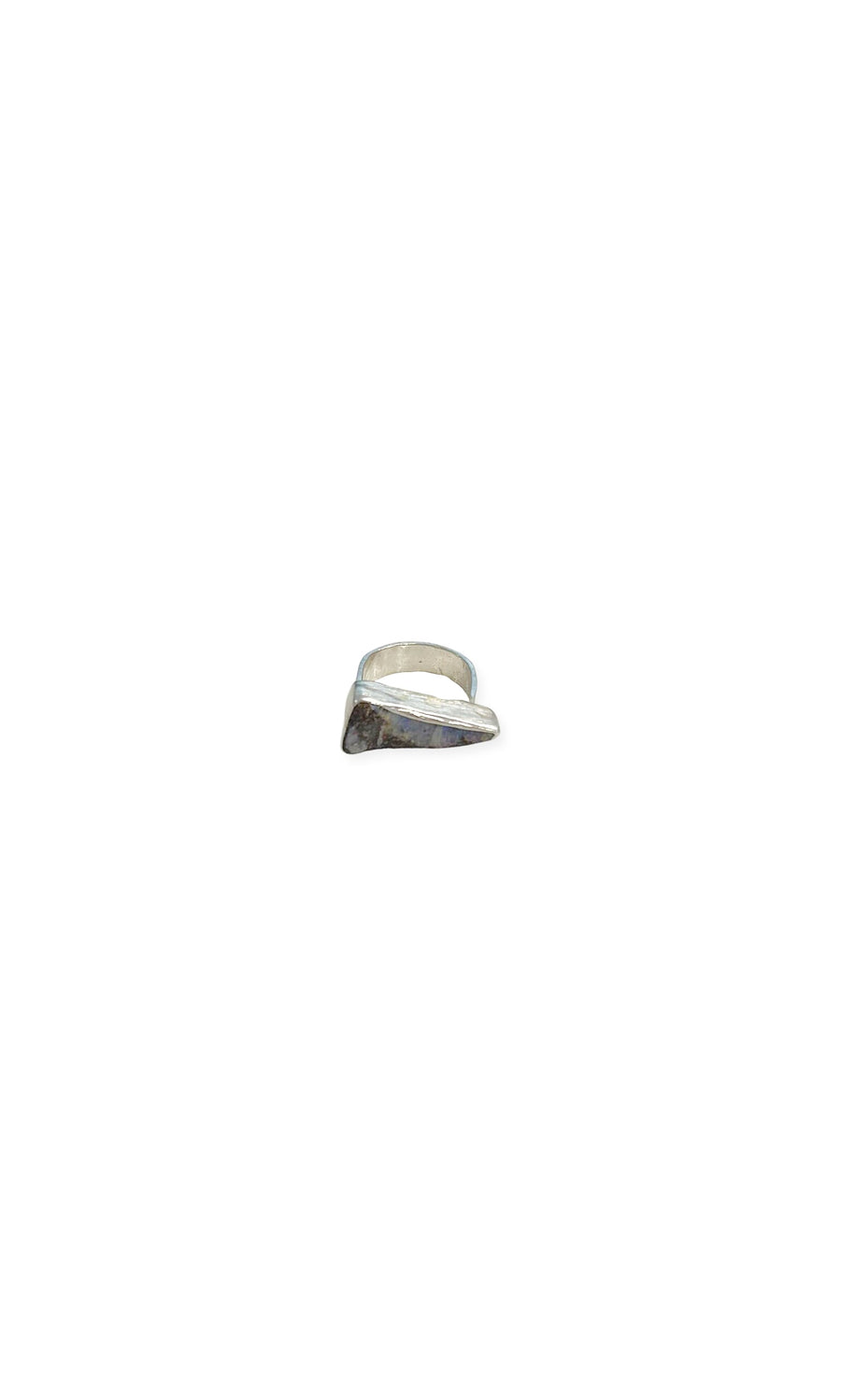Plümo- The Celesse Ring is a handcrafted silver piece with an asymmetrical, angular design on a plain white background.